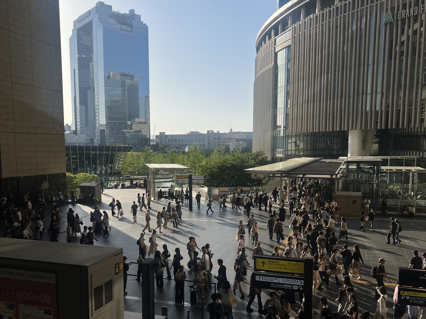 Commuters crossing the plaza outside Osaka Station — the kind of orderly, high-volume foot traffic Japan is famous for.